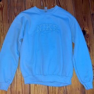 Nike crewneck sweater. Never worn. Fits a little snug.